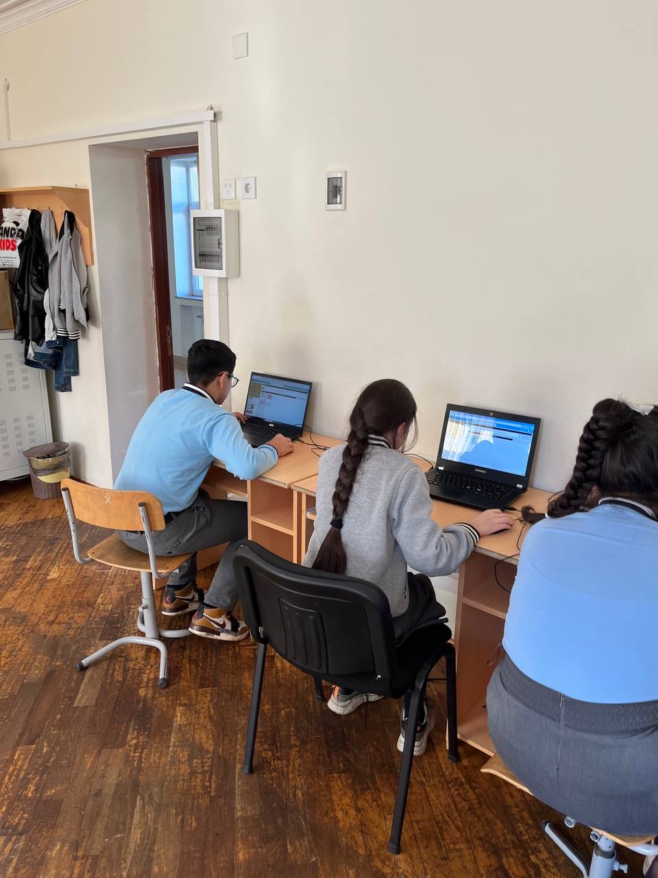 Several children learning via computers