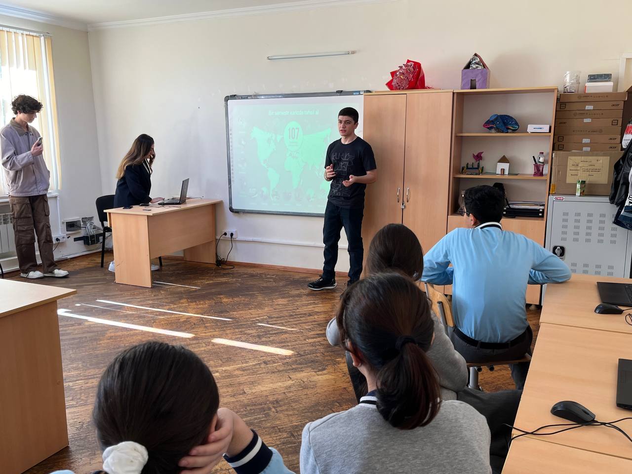 A student teaching several children