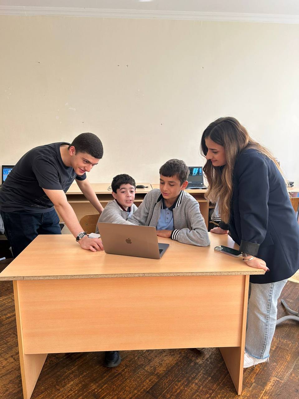 Students explaining to children